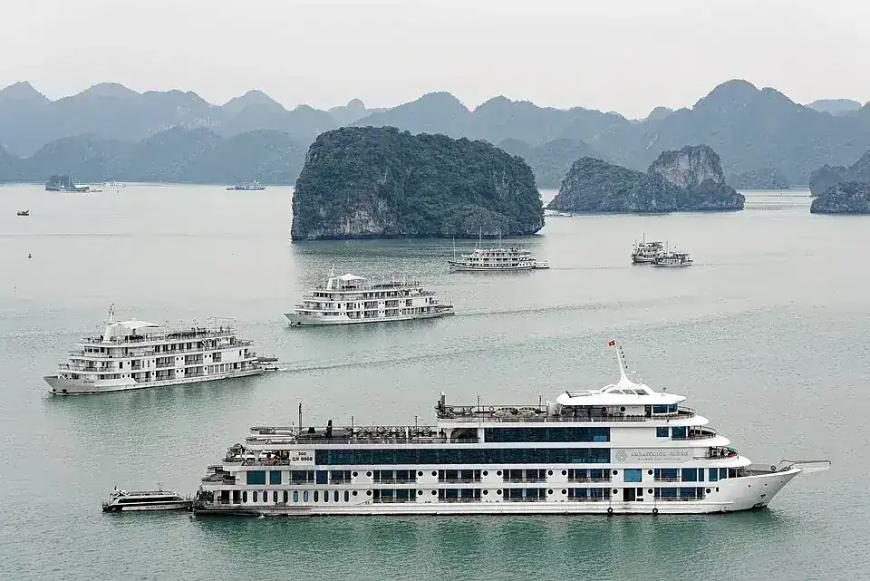 Boats and limestone islands in Hạ Long Bay from Titov